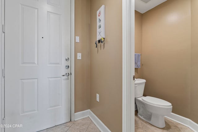 bathroom featuring tile patterned flooring and toilet