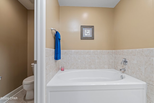 bathroom featuring toilet and a bathing tub