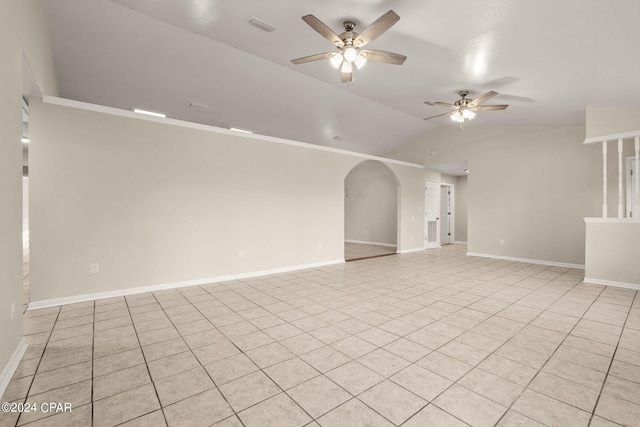 tiled spare room with ceiling fan and vaulted ceiling