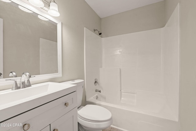 full bathroom featuring washtub / shower combination, vanity, and toilet