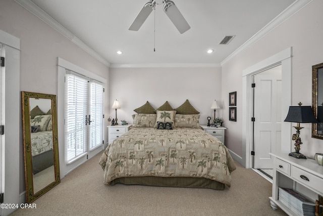 carpeted bedroom with ceiling fan and ornamental molding