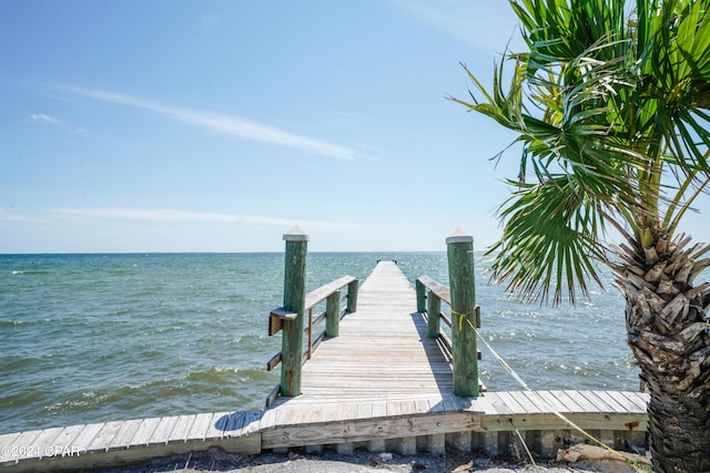 view of dock with a water view