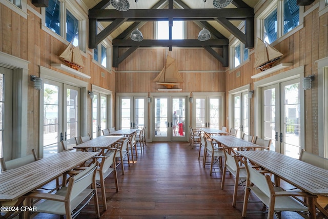 dining room featuring french doors and high vaulted ceiling