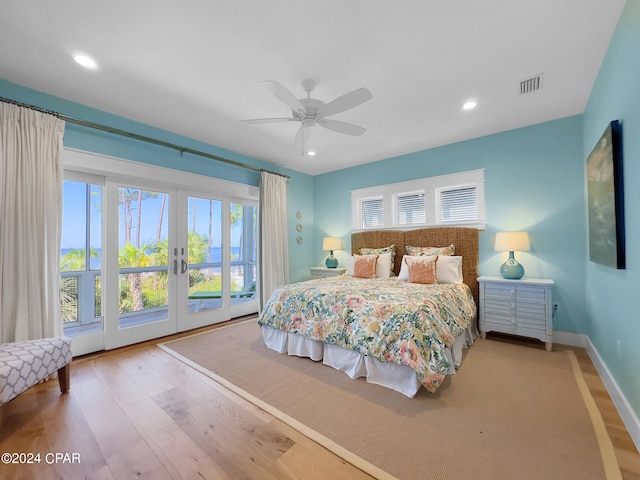 bedroom featuring access to outside, ceiling fan, french doors, and wood-type flooring