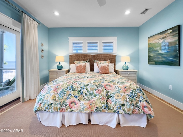 carpeted bedroom featuring access to exterior and ceiling fan