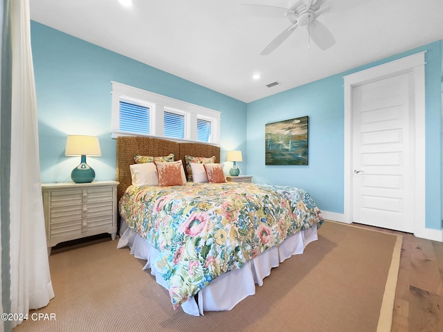 bedroom featuring ceiling fan and wood-type flooring