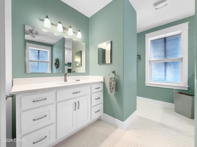 bathroom featuring tile patterned floors, ceiling fan, and vanity