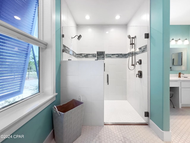 bathroom featuring vanity and an enclosed shower