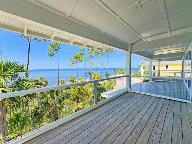 wooden deck featuring a water view