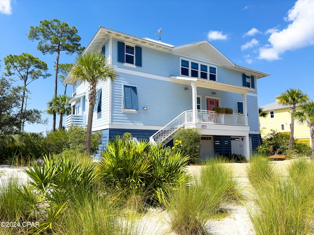 coastal inspired home with covered porch