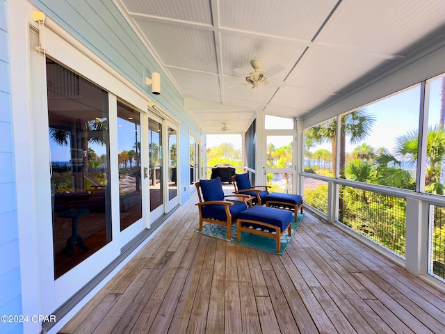 sunroom featuring plenty of natural light and ceiling fan