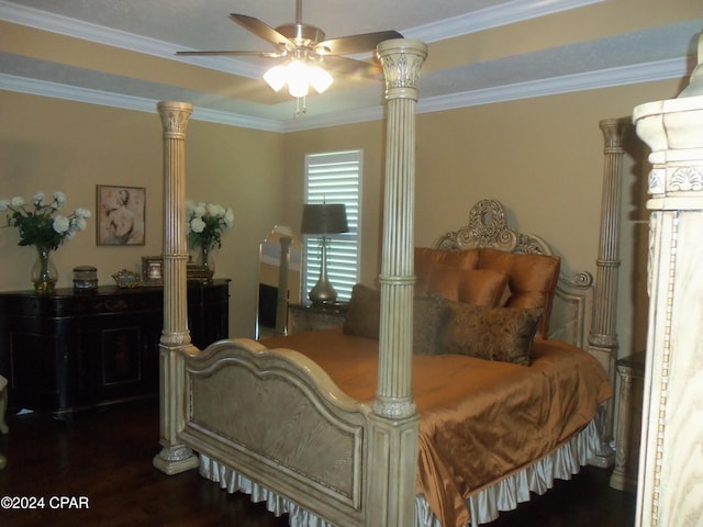 bedroom featuring ornamental molding, ceiling fan, and dark wood-type flooring