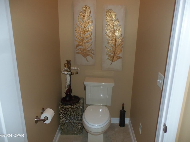 bathroom featuring toilet and tile patterned floors