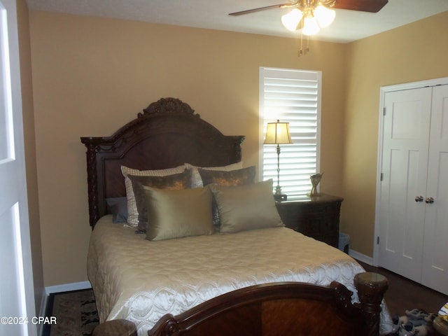 bedroom featuring ceiling fan and a closet