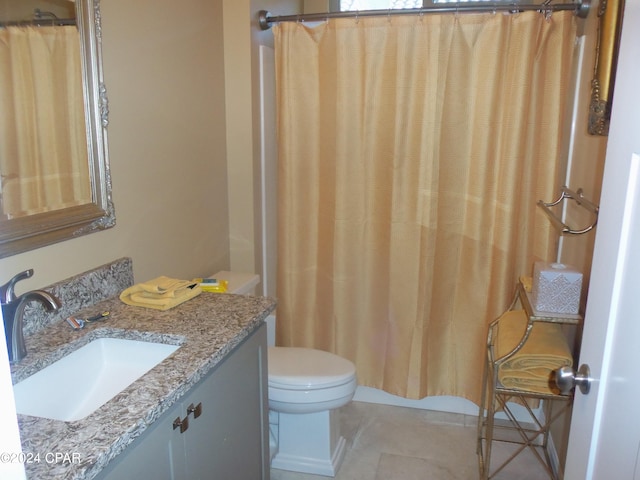 bathroom featuring toilet, tile patterned flooring, vanity, and a shower with shower curtain