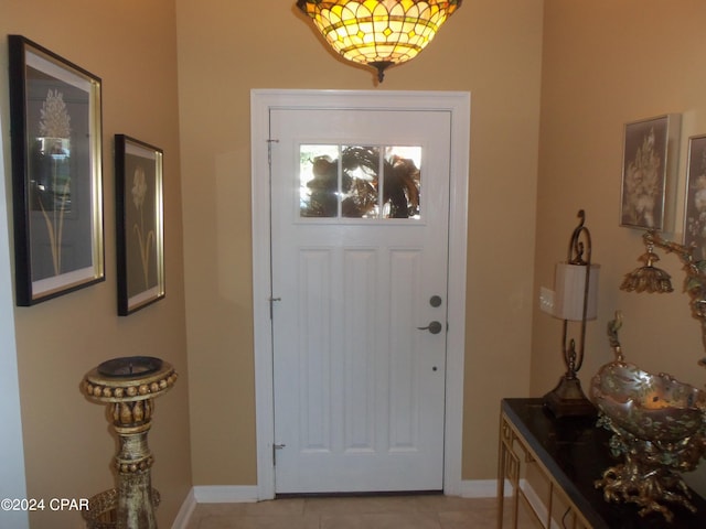 foyer entrance with light tile patterned floors