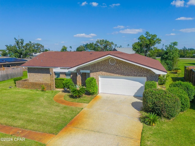 single story home with a garage and a front yard