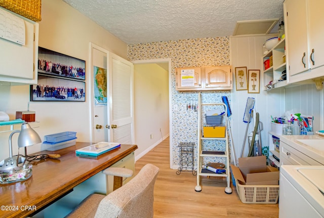 office with washer / dryer, a textured ceiling, and light hardwood / wood-style flooring