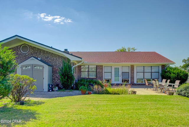 single story home featuring a patio and a front lawn