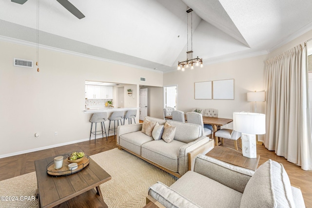 living room featuring ceiling fan with notable chandelier, ornamental molding, and high vaulted ceiling