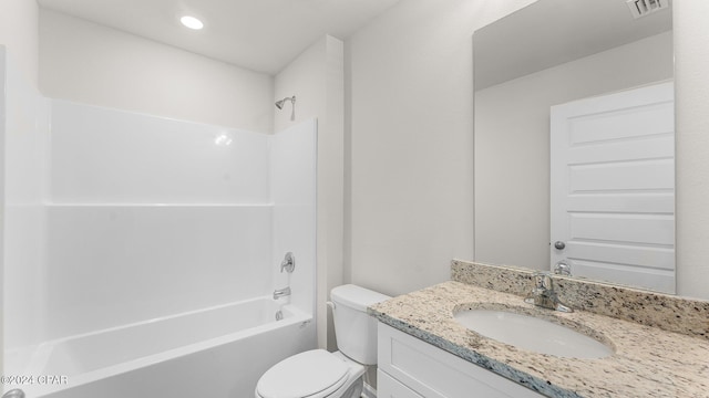 full bathroom with vanity, tub / shower combination, and toilet