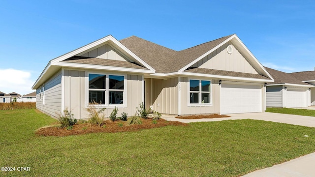 view of front of house featuring a garage and a front yard