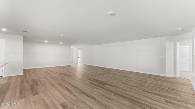 spare room with light hardwood / wood-style flooring