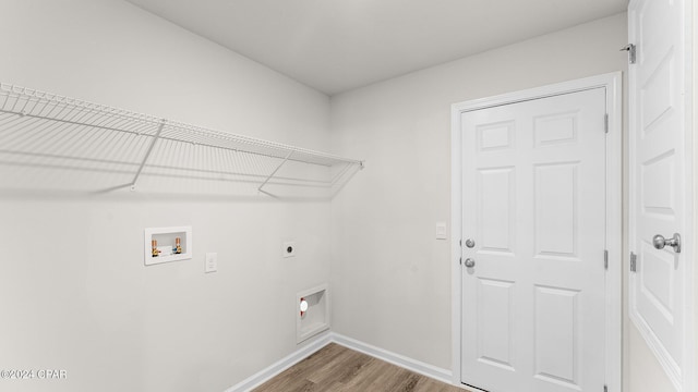 laundry area featuring washer hookup, wood-type flooring, and hookup for an electric dryer