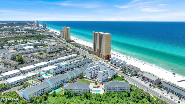 bird's eye view with a water view and a view of the beach