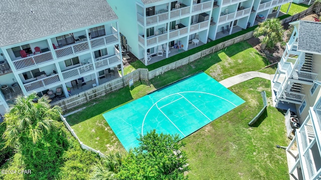 view of basketball court featuring a yard