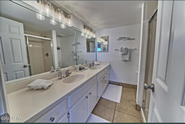 bathroom with vanity, tile patterned floors, and a shower with shower door