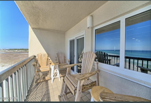 balcony featuring a water view