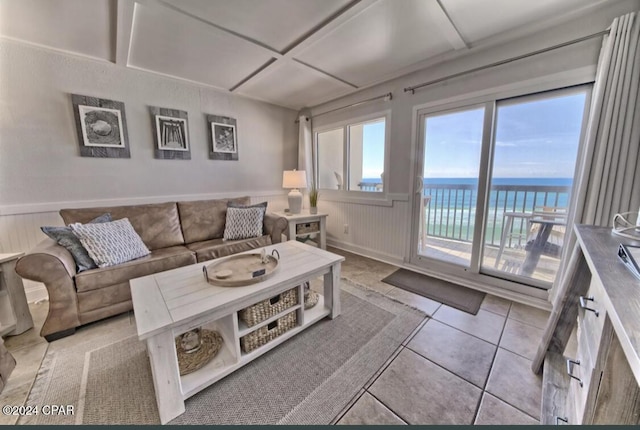 tiled living room with a water view