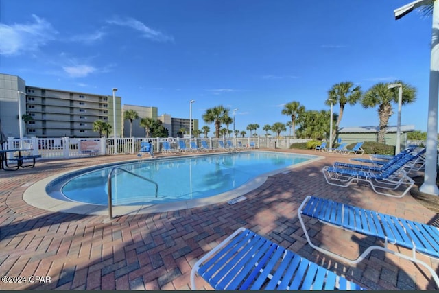 view of swimming pool with a patio