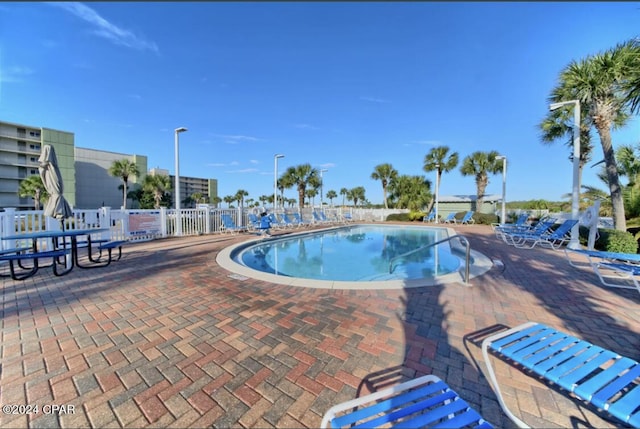 view of swimming pool featuring a patio area