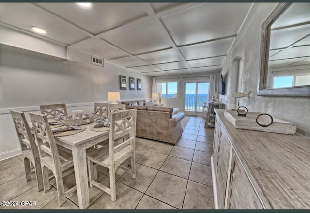 dining space featuring light tile patterned floors