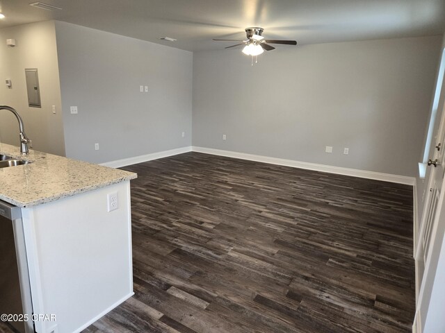 spare room with dark hardwood / wood-style floors and ceiling fan