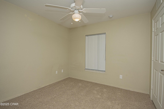 unfurnished bedroom featuring carpet flooring, a ceiling fan, and visible vents