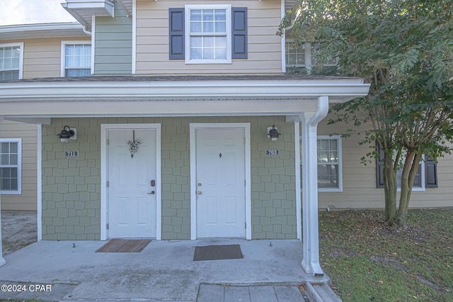 doorway to property with a porch