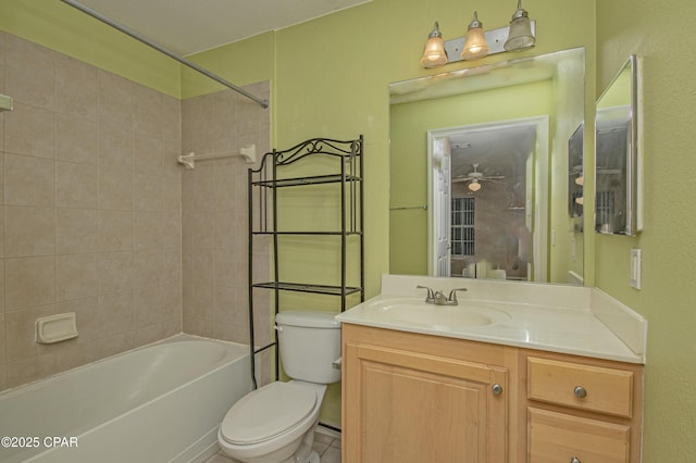 bathroom featuring shower / bath combination, vanity, toilet, and ceiling fan