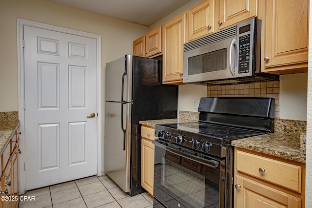 kitchen with light stone countertops, appliances with stainless steel finishes, light tile patterned flooring, decorative backsplash, and light brown cabinets