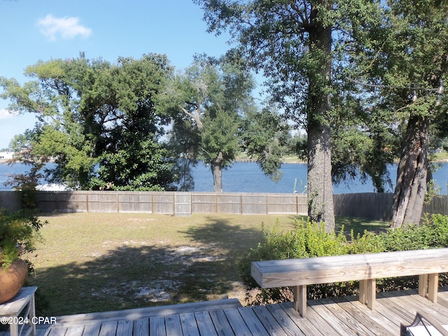 view of yard featuring a deck with water view