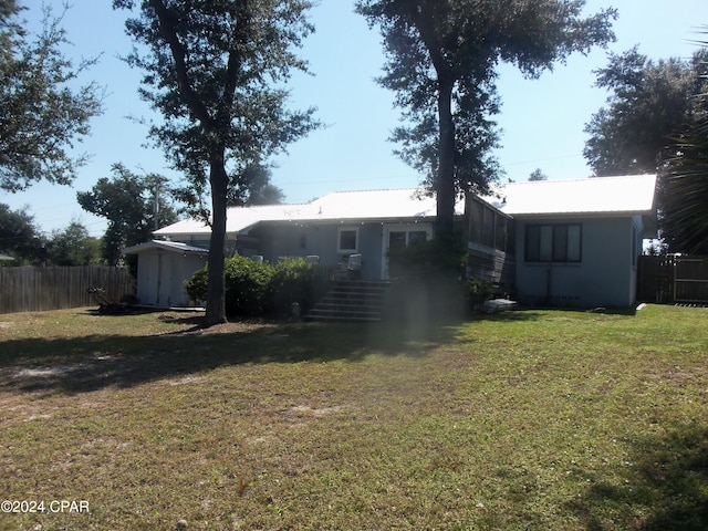 view of yard with a sunroom