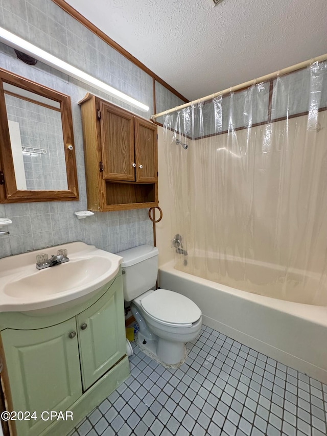 full bathroom featuring a textured ceiling, toilet, vanity, shower / bathtub combination with curtain, and tile patterned flooring