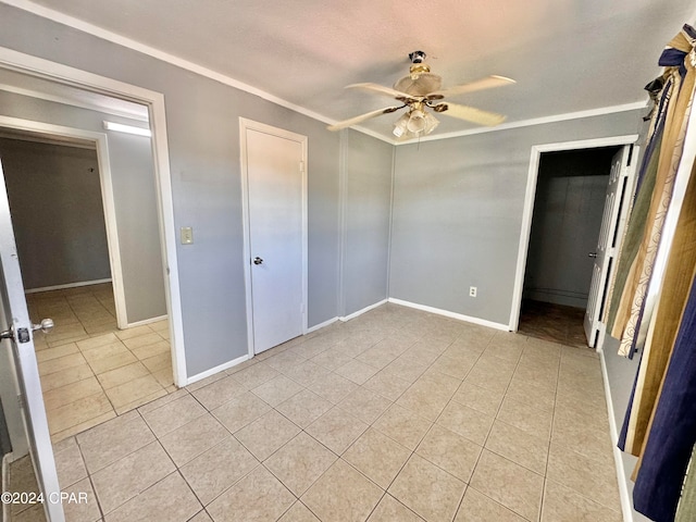 unfurnished bedroom with ceiling fan, ornamental molding, and light tile patterned flooring