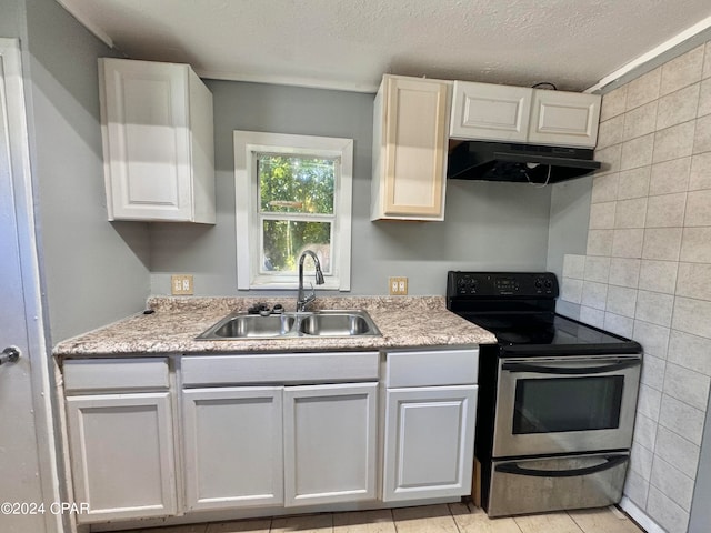 kitchen featuring a textured ceiling, white cabinetry, sink, and electric stove