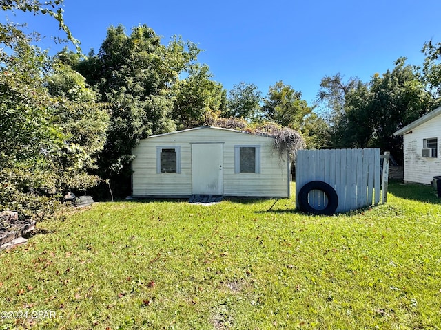 view of outdoor structure featuring a yard