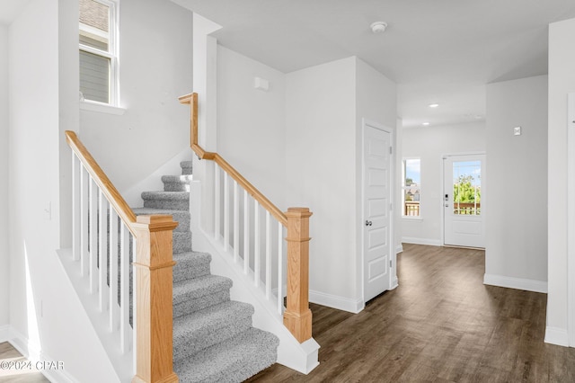 stairway featuring hardwood / wood-style flooring