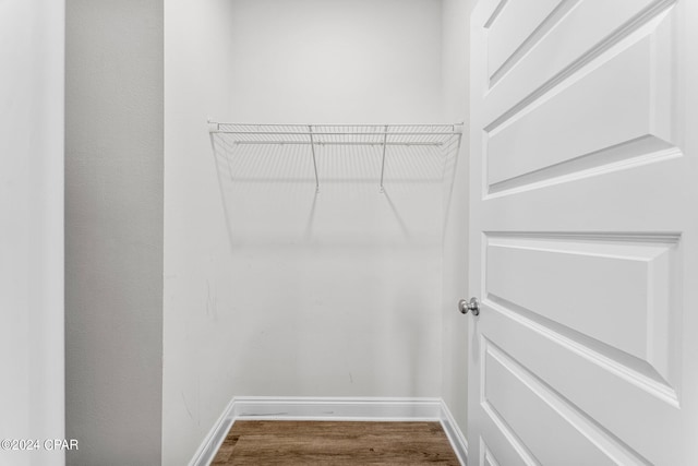 walk in closet featuring hardwood / wood-style flooring