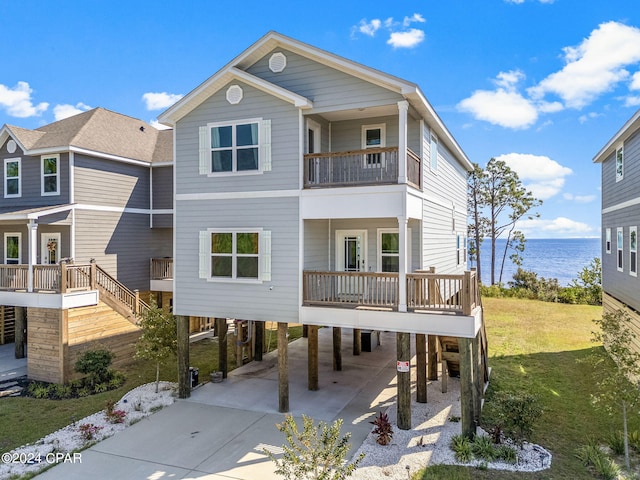 view of front of house with a front yard and a carport